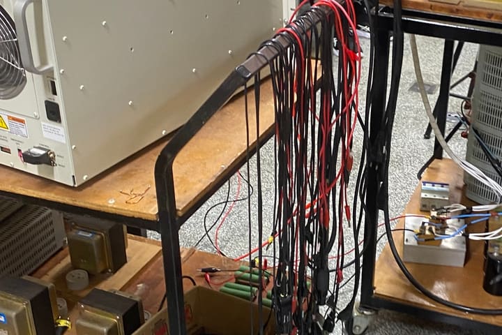 Bench equipment, transformers and test leads in the electrical engineering laboratory.